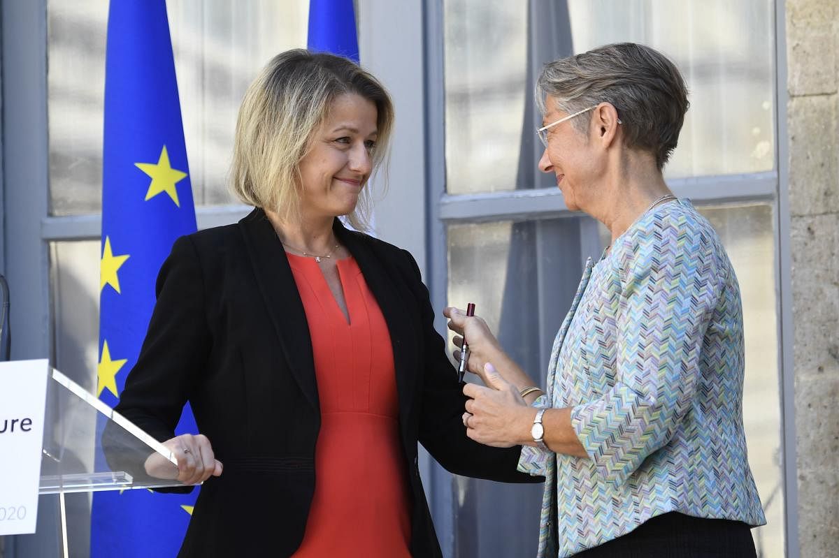 Former French Minister for the Ecological and Inclusive Transition Elisabeth Borne (R) speaks with newly appointed Minister for the Ecological Transition Barbara Pompili (L) during the handover ceremony at the French ministry of ecology in Paris on July 7, 2020 following the French cabinet reshuffle. Credit: AFP