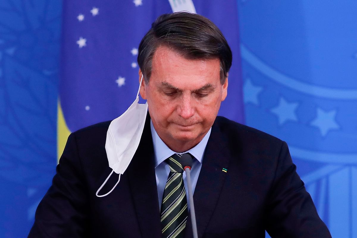 March 24 - Bolsonaro urges mayors and state governors to roll back lockdown measures in a televised national address. Credit: AFP