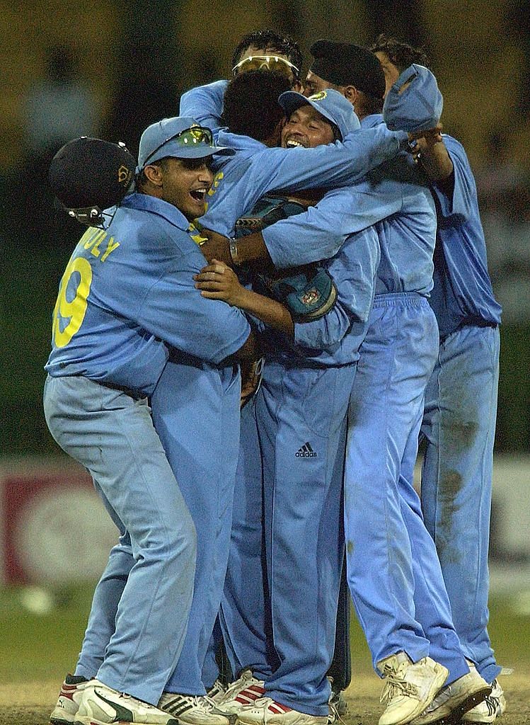 Virender Sehwag of India is mobbed by teammates with captain Sourav Ganguly on the right after beating South Africa during the South Africa v India Semi Final match of the ICC Champions Trophy at the R. Premadasa Stadium, Colombo, Sri Lanka on September 25, 2002. Credit: Getty Images