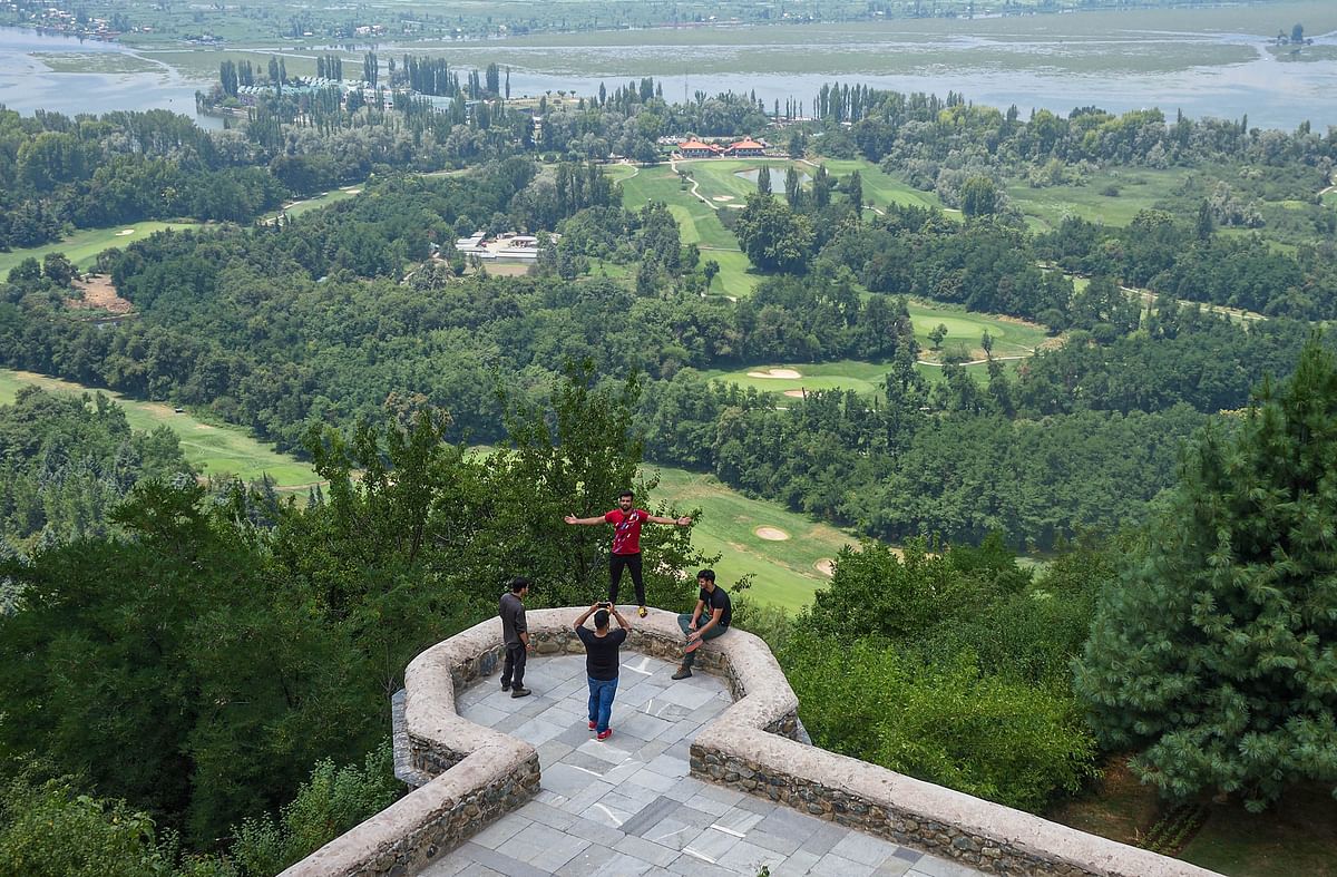 Visitors at Mughal Garden after the authorities decided to reopen it for tourists, during Unlock 2.0, in Srinagar. Credits: PTI Photo