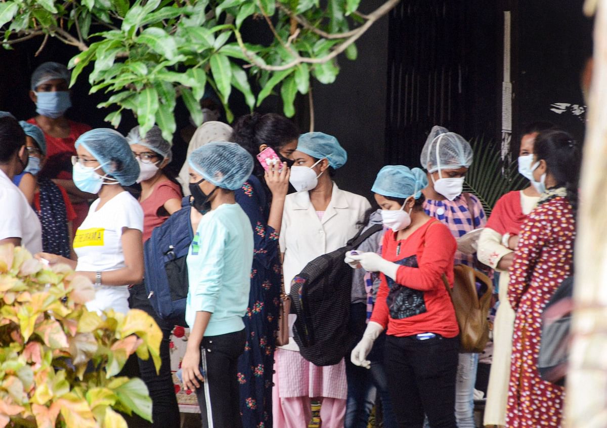 Students of nursing college of Rajendra Institute of Medical Science (RIMS) and staff wait after emergence of COVID-19 cases, during Unlock 2.0, in Ranchi. Credits: PTI Photo