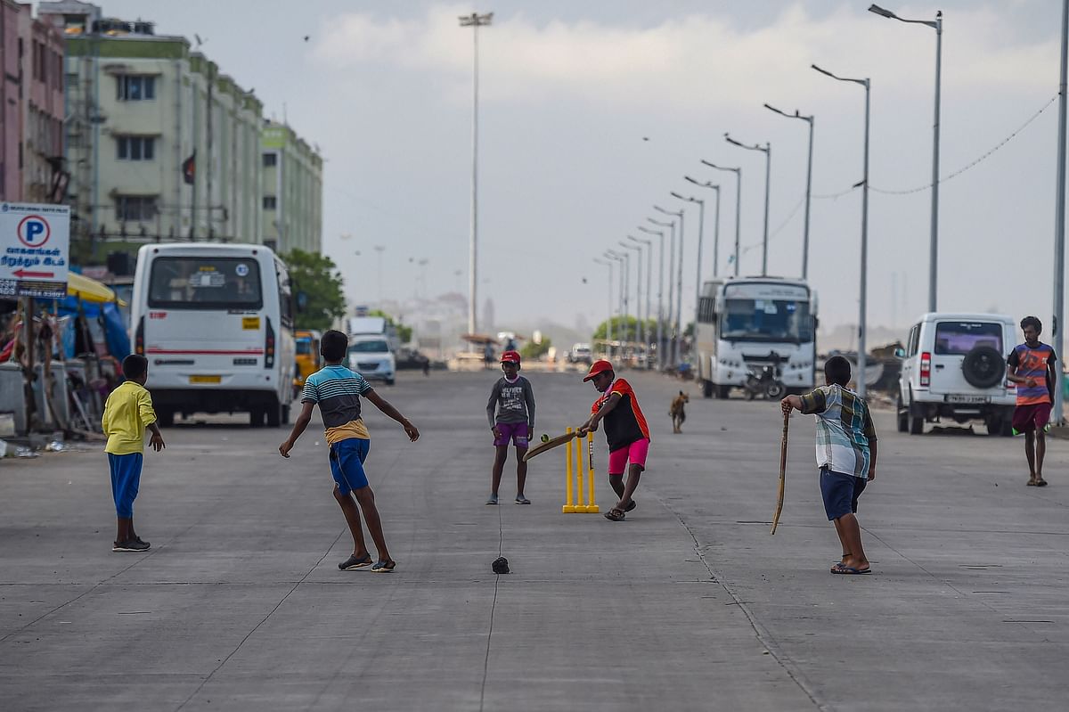 Boys play cricket on a street during an intensified lockdown as a preventive measure against the spread of coronavirus disease, in Chennai. Credits: PTI Photo