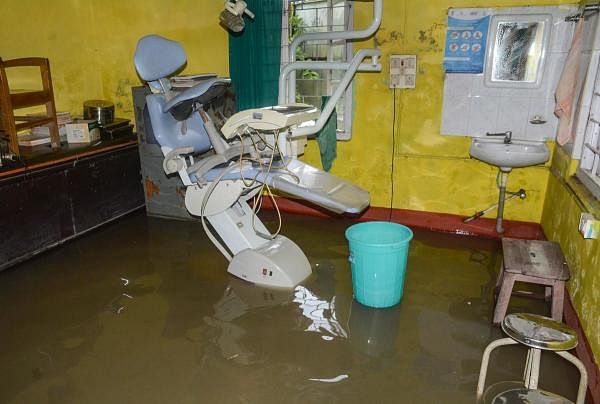 A view of a flooded dentist's room at a hospital at Pathsala in Barpeta district of Assam, Sunday, July 12, 2020. Credit: PTI Photo