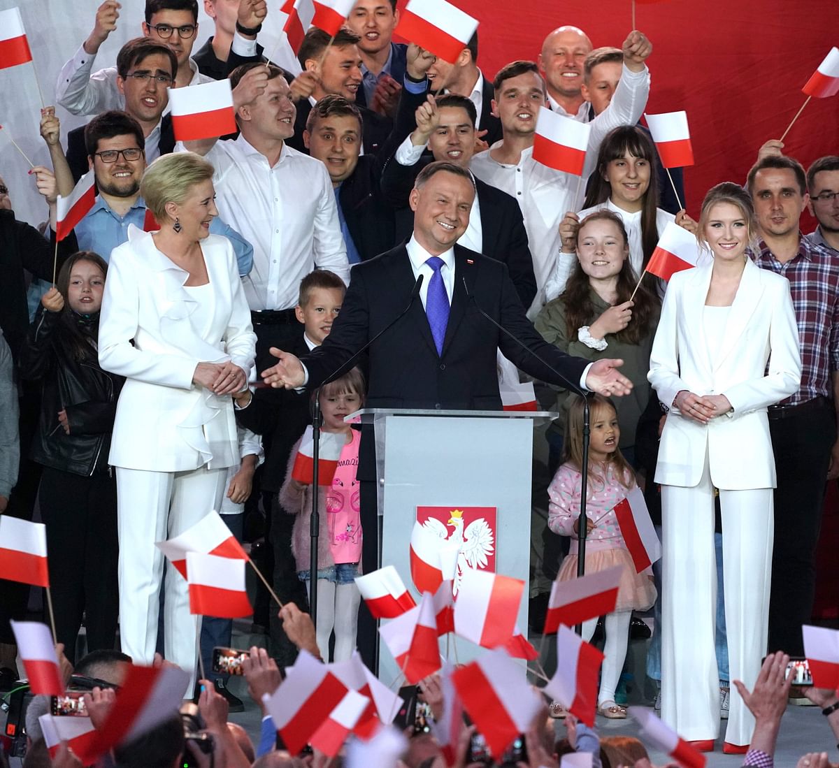 Polish President Andrzej Duda addresses supporters as exit poll results were announced during the presidential election in Pultusk, Poland, on July 12, 2020. - Poland's right-wing head of state Andrzej Duda was ahead by a tiny margin in the presidential run-off against Warsaw's liberal mayor, an exit poll on on July 12, 2020 showed, starting a tense wait for the official results Credit: AFP Photo