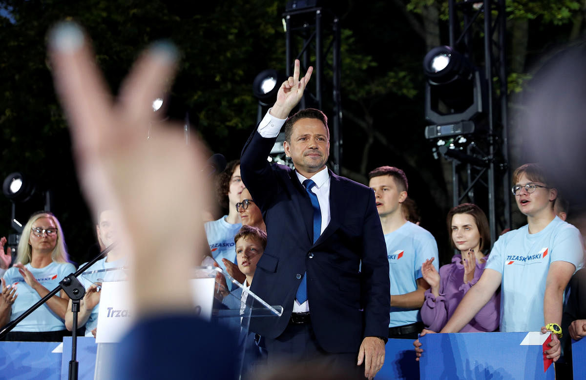 Warsaw Mayor Rafal Trzaskowski, presidential candidate of the main opposition Civic Platform (PO) party, reacts after the announcement of the first exit poll results on the second round of the presidential election in Warsaw, Poland. Credit: REUTERS