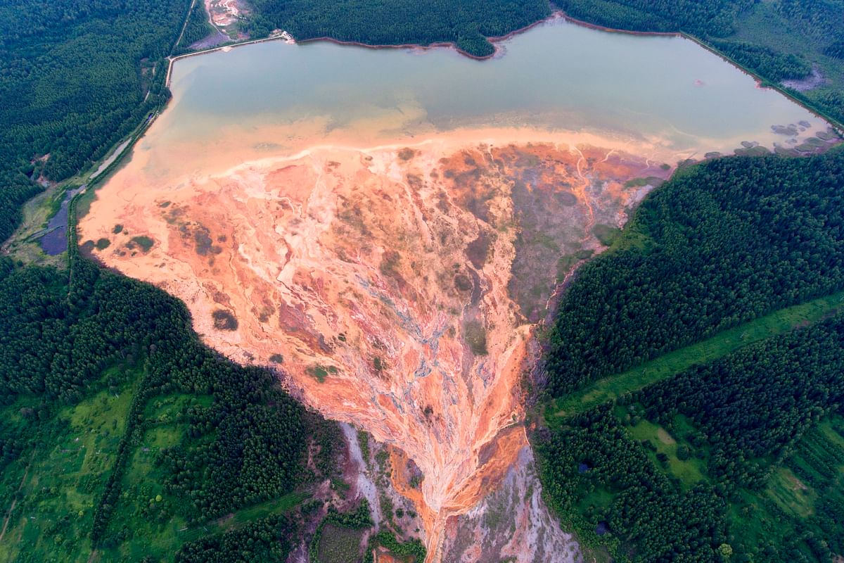 Orange-coloured rivers fanning out over the forested landscape near a disused copper-sulphide mine near the village called Lyovikha in the Urals.Russian prosecutors on July 15, 2020 said they were conducting an inspection of a facility supposed to treat acid runoff from an abandoned Urals mine after photographs emerged of nearby rivers running orange. Credit: AFP