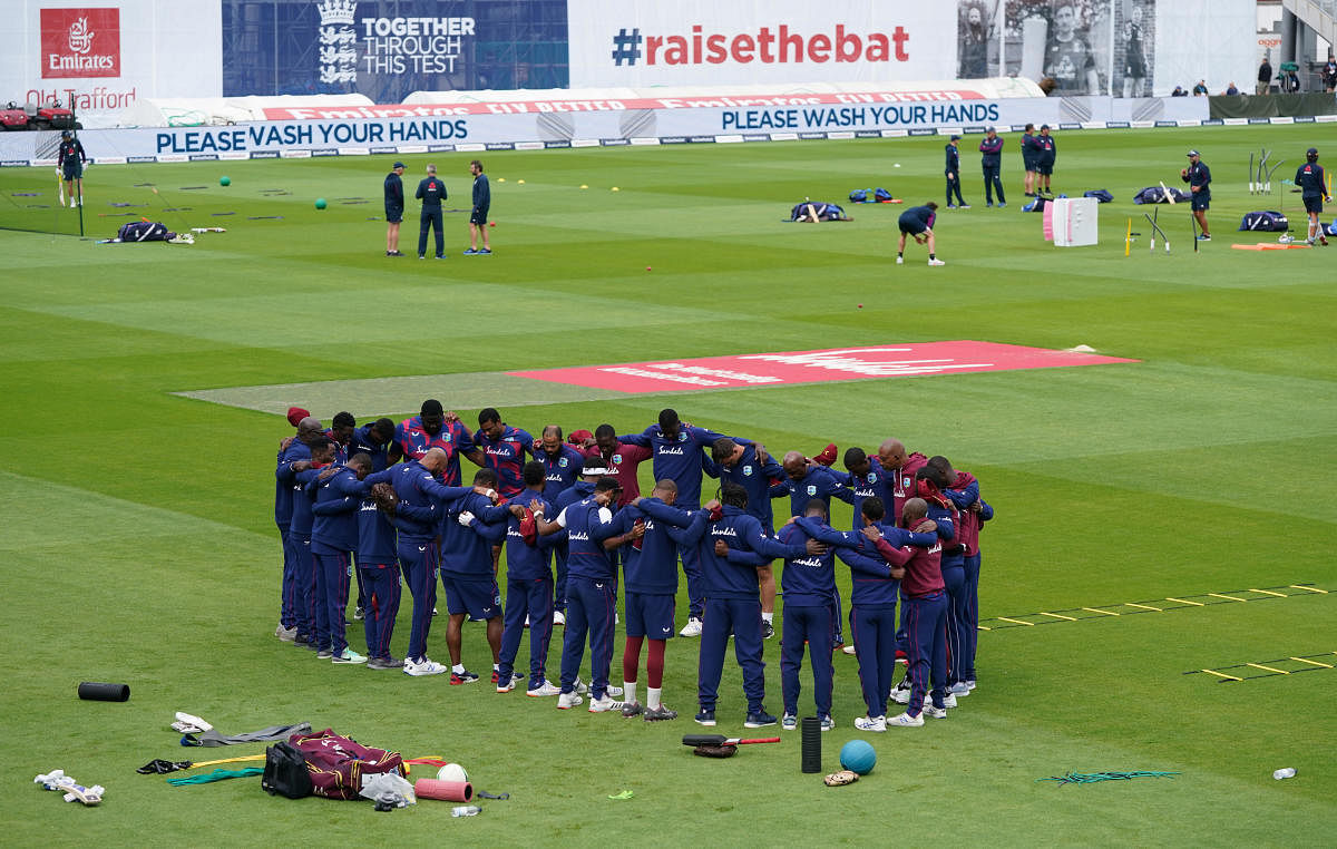 The West Indies team huddle before the start, as play resumes behind closed doors following the outbreak of the coronavirus disease (Covid-19). Credit: REUTERS
