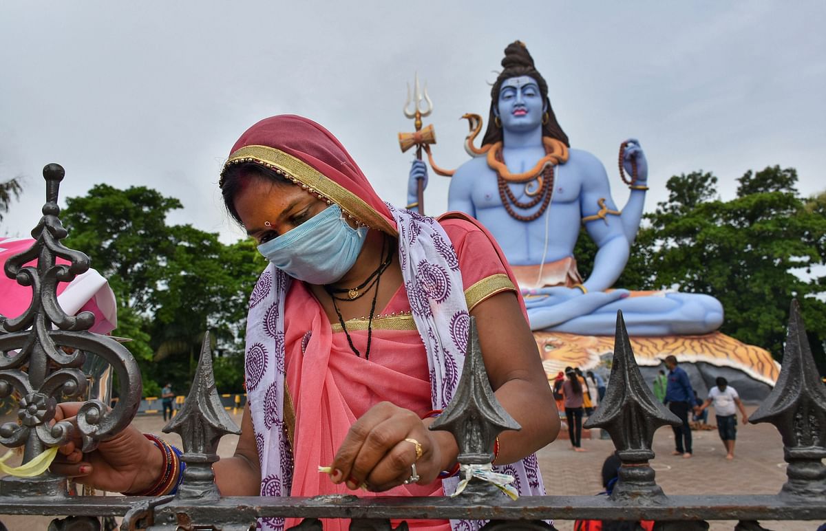 Devotees offer prayers to Lord Shiva on the third 'Somwar' of the holy month of 'Shravan', in Jabalpur, Monday, July 20, 2020. Credit: PTI Photo