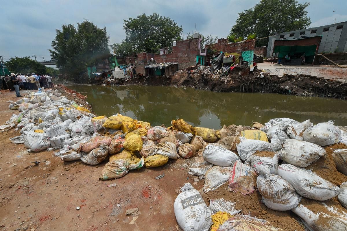 View of the site of a building collapse due to monsoon rain near ITO, at Anna Nagar slum in New Delhi, Monday, July 20, 2020. Credit: PTI Photo