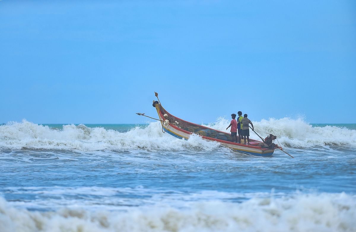 Fishermen head to sea in a motorised fishing boat as they commence fishing activity during Unlock 2.0, at Marina beach in Chennai, Monday, July 20, 2020. Credit: PTI Photo