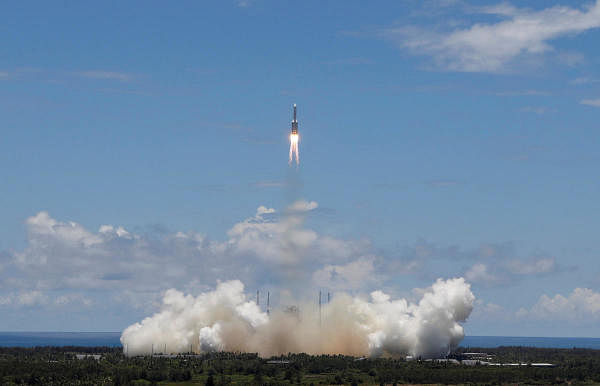 The Long March 5's journey through space will take about seven months, while landing will take seven minutes. China's probe will carry several scientific instruments to observe the planet's atmosphere and surface, searching for signs of water and ice. Credit: Reuters Photo