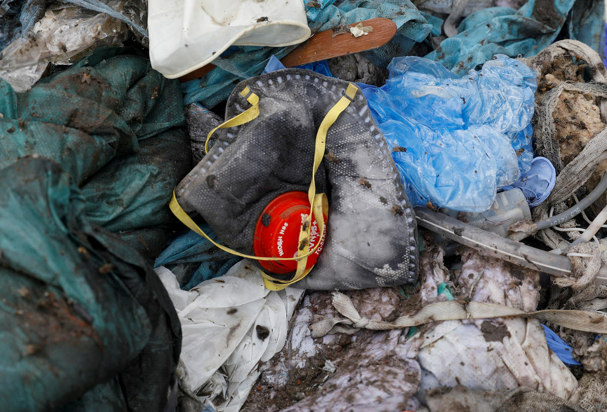 Under the fresh guidelines issued by the Central Pollution Control Board (CPCB), used masks & gloves from home quarantine or other households after keeping aside in paper bag for 72 hours are supposed to be cut into pieces to prevent re-use prior to handing over the same to waste collector of Urban Local Body as general solid waste.Credit: Reuters Photo