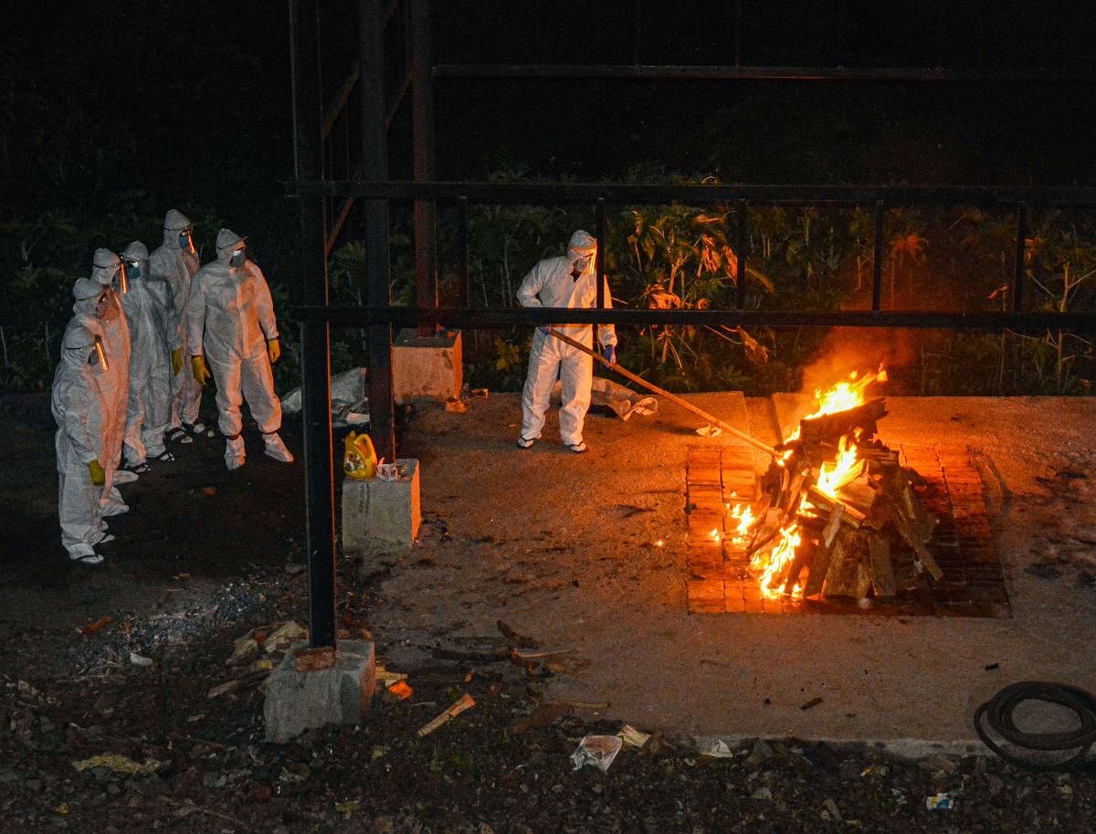 Used masks from visitors to crematorium/ graveyards including crematorium staff should be collected in separate bins and stored for 72 hours prior to disposal as dry general solid waste through local bodies. Credit: PTI Photo