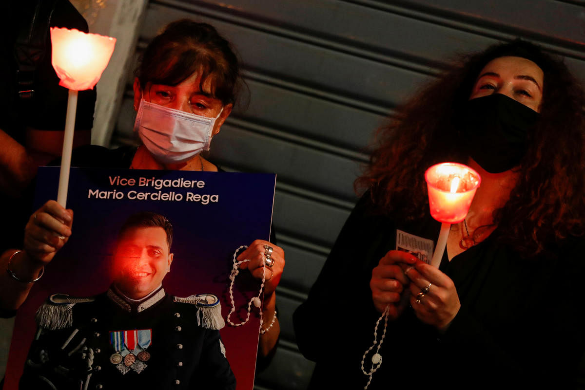 The widow of an Italian carabinieri Mario Cerciello Rega, Rosa, and his mother take part in a candlelight vigil to mark the one anniversary since the death of her husband, Mario Cerciello Rega in Rome, Italy. Credit: Reuters