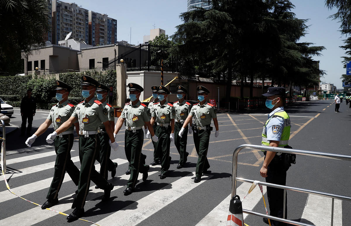 Chinese paramilitary police march outside the US Consulate General in Chengdu, Sichuan province, China. Credit: Reuters