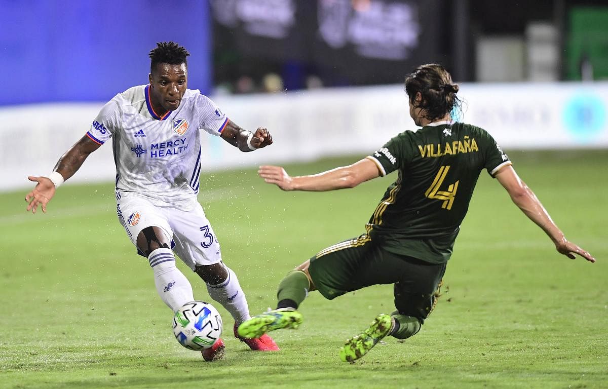 Portland Timbers compete for the ball in the first half of a round of sixteen match of the MLS Is Back Tournament. Credit: AFP