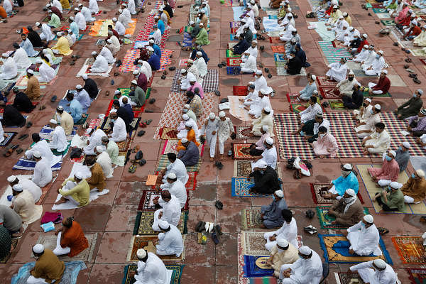 Muslims wearing face masks leave the Jama Masjid (Grand Mosque) after Eid al-Adha prayers. Credit: Reuters