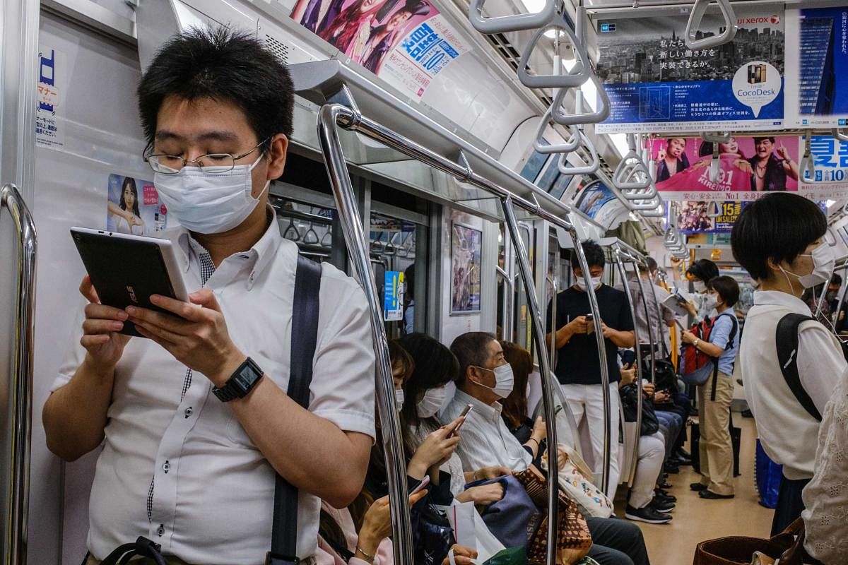 Don’t leave home without a bottle of hand sanitizer that’s at least 60% alcohol and disinfectant wipes to clean your phone, which is a germ magnet. And anytime you’re in close quarters with other people, wear your mask, Don't pack more than necessary. Credit: AFP