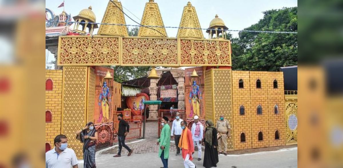 eople move past the Ram Janmabhoomi Nyas workshop, ahead of the ground breaking ceremony of the 'Ram Mandir' in Ayodhya. Credit: PTI Photo