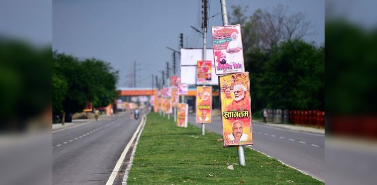 Hoardings of India's Prime Minister Narendra Modi and other political leaders are seen on a road ahead of the ground-breaking ceremony. Credit: AFP Photo