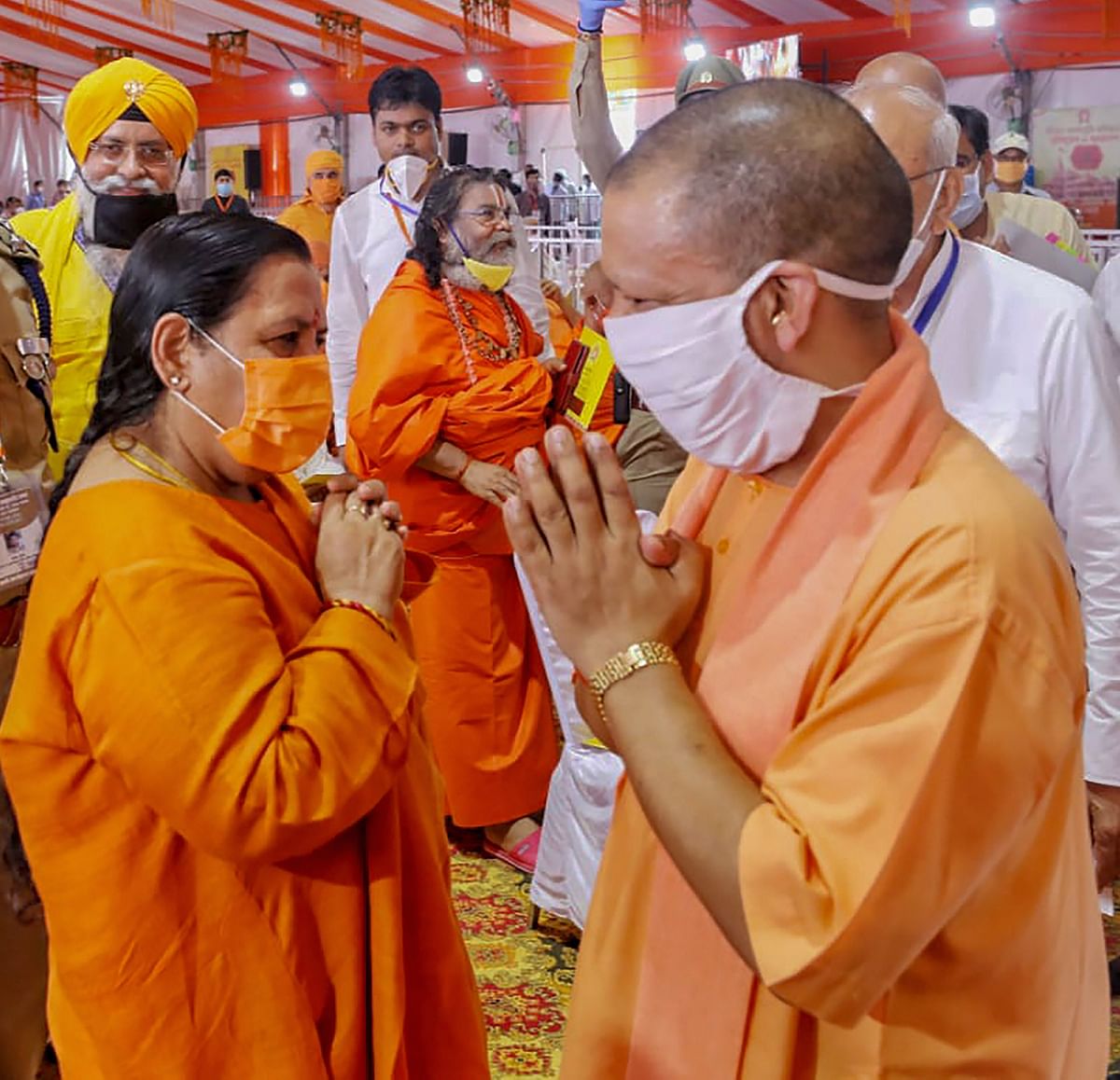 Uttar Pradesh Chief Minister Yogi Adityanath being greeted by BJP leader Uma Bharti during the function ahead of the inception of Bhoomi Pujan. Credit: PTI