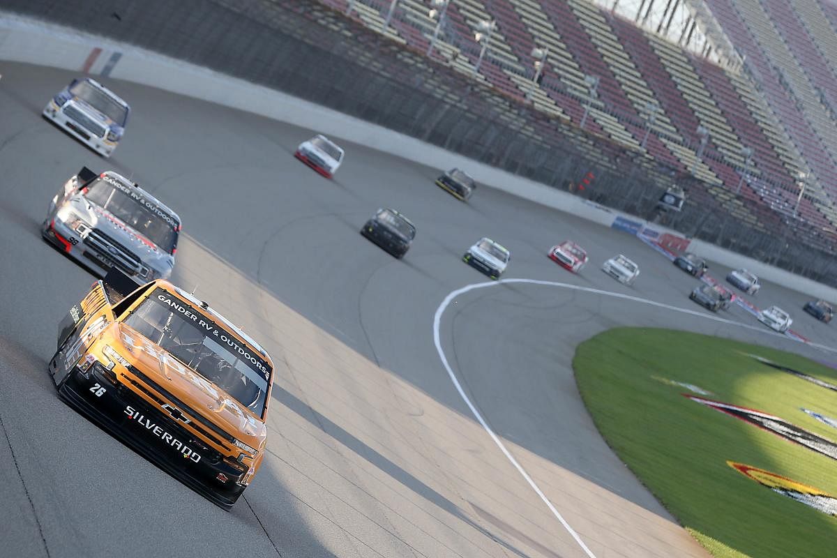 Tyler Ankrum, driver of the LiUNA! Chevrolet, leads the field during the NASCAR Gander RV & Outdoors Truck Series Henry Ford Health System 200 at Michigan International Speedway. Credit: AFP