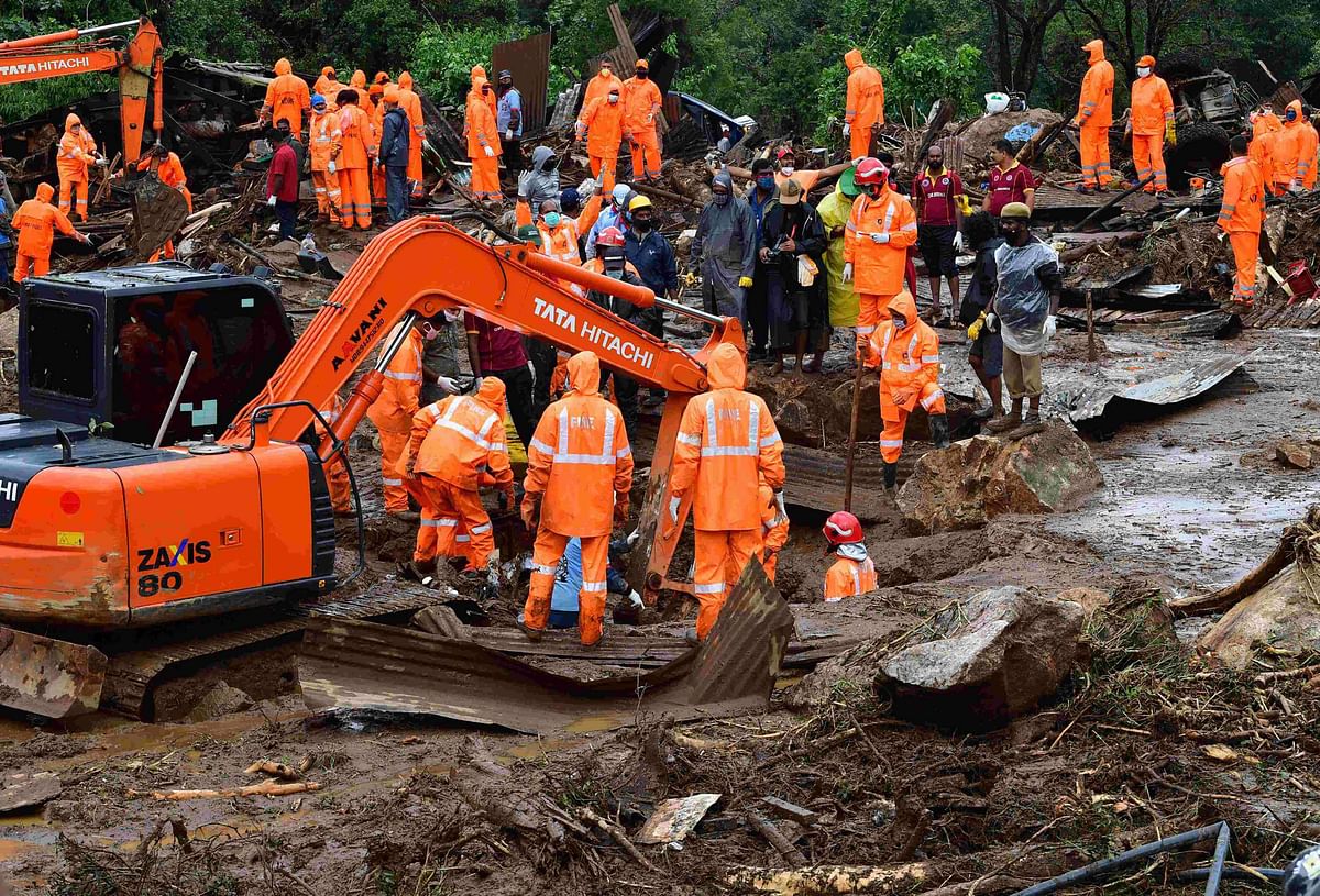 Rescue workers search for missing people at a landslide site caused by heavy rains in Pettimudy, in Kerala state, on August 8, 2020. Credit: AFP