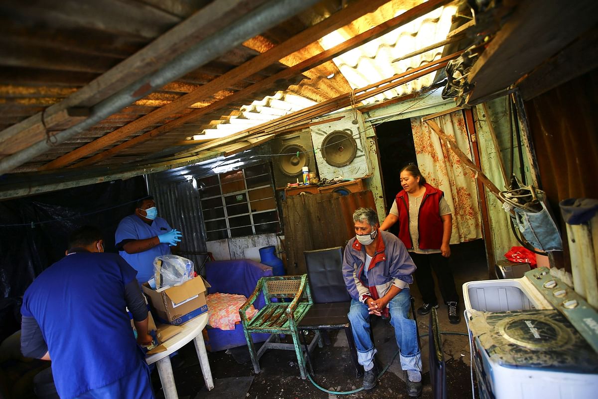 Narcizo, 64, and his wife wait to be tested for the coronavirus disease (COVID-19) inside their house, which is over a Chinampa, or floating garden, in Xochimilco, one of the highly contagious zones, on the outskirts of Mexico City. Credit: Reuters