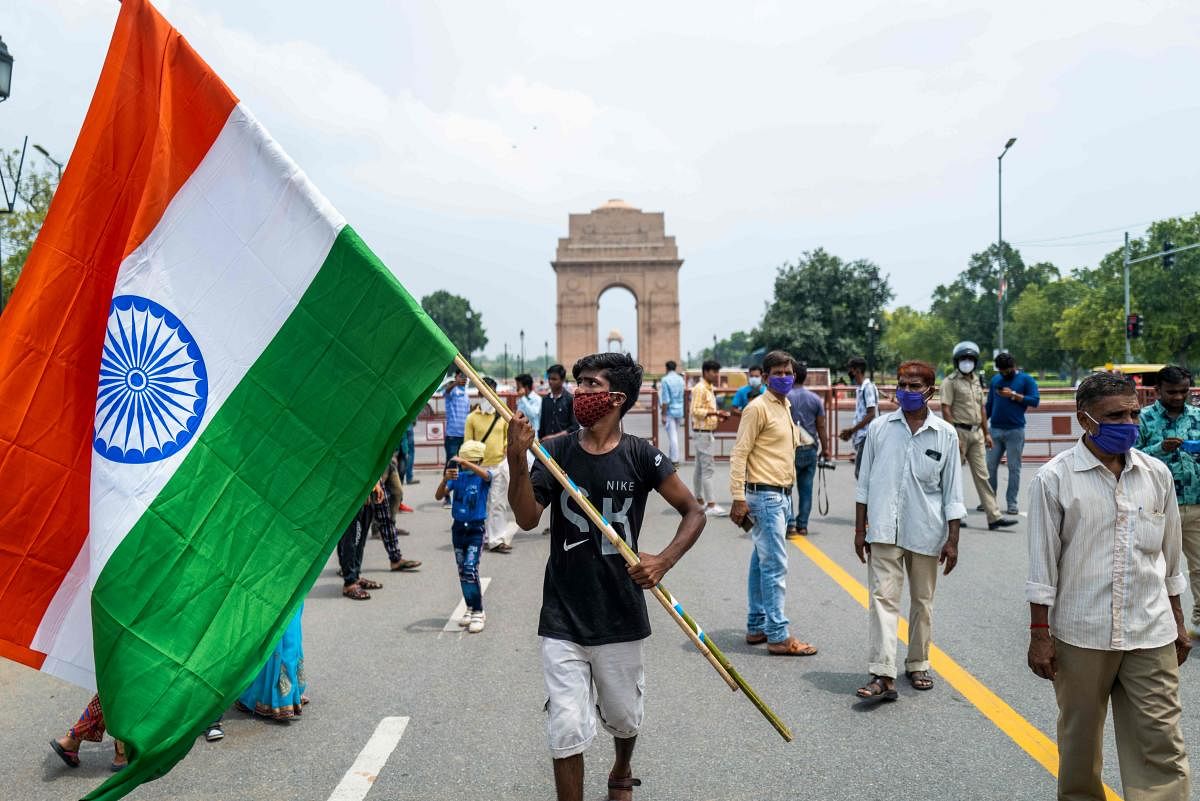 People gather at Rajpath road near India Gate to celebrate the country's 74th Independence Day in New Delhi. Credit:A FP