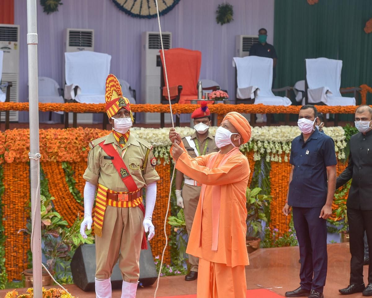 Uttar Pradesh Chief Minister Yogi Adityanath hoists the Tricolor during the 74th Independence Day celebrations, at Vidhan Bhawan in Lucknow. Credit: PTI