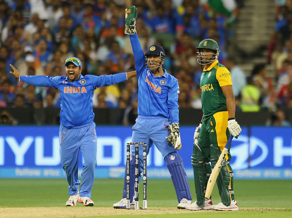 MS Dhoni and Suresh Raina of India appeal successfully to dismiss Vernon Philander of South Africa during the 2015 ICC Cricket World Cup match between South Africa and India at Melbourne Cricket Ground on February 22, 2015 in Melbourne, Australia. Credit: Getty Images