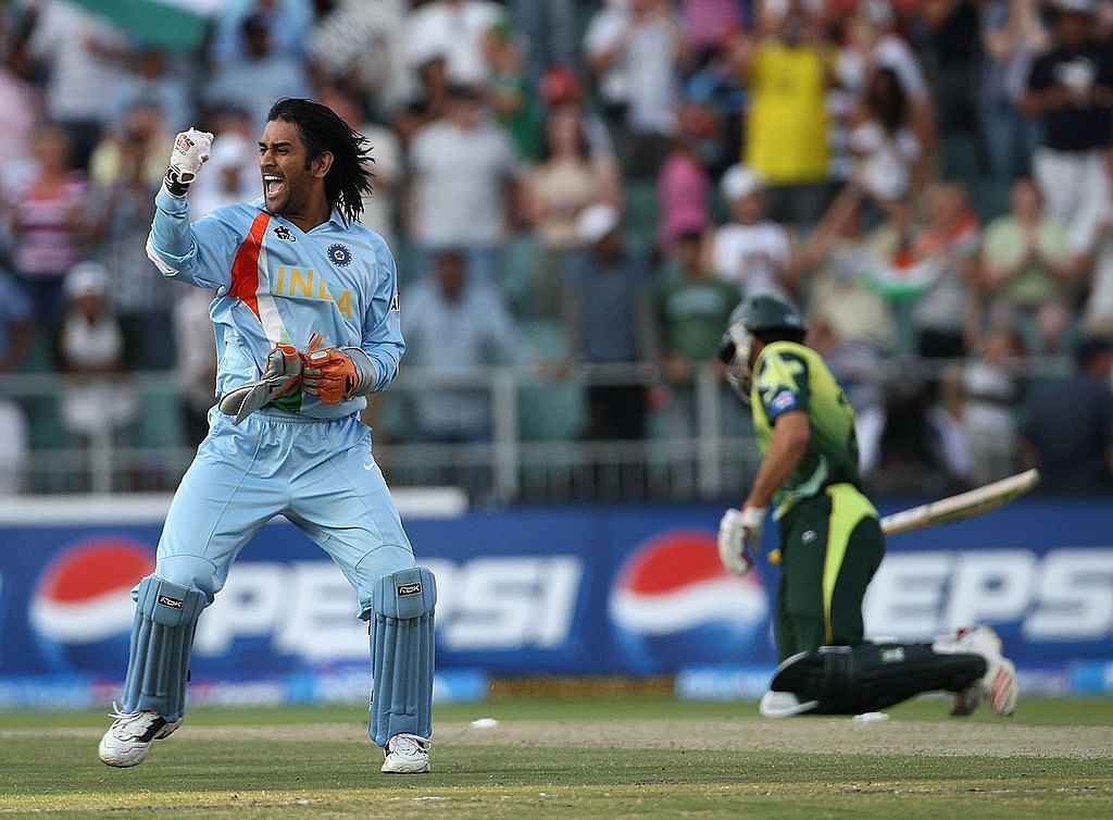 MS Dhoni of India celebrates his team's victory with Misbah-ul-Haq of Pakistan looking on during the Twenty20 Championship Final match between Pakistan and India at The Wanderers Stadium on September 24, 2007 in Johannesburg, South Africa. Credit: Getty Images