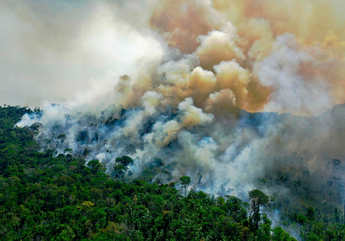 Aerial view of a burning area of Amazon rainforest reserve, south of Novo Progresso in Para state. Credits: AFP Photo