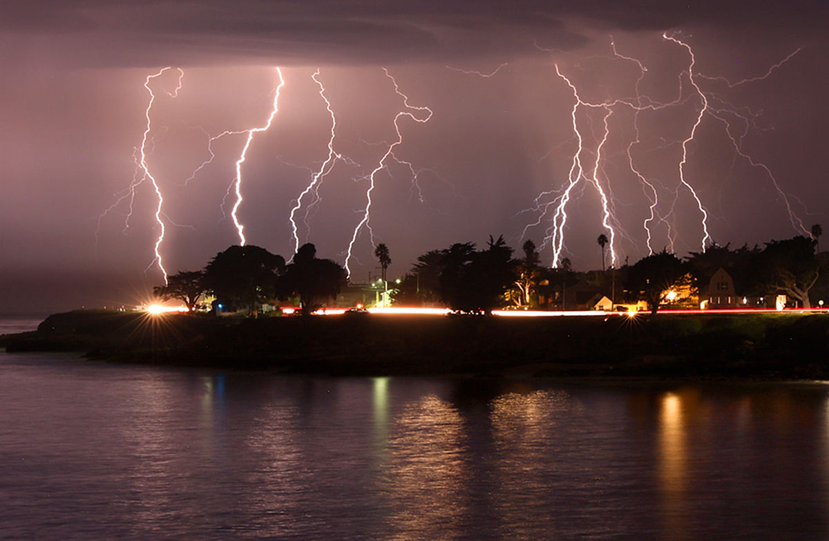 A rare lightning storm crackles over Mitchell's Cove in Santa Cruz, California around 3 a.m. Credits: AP Photo