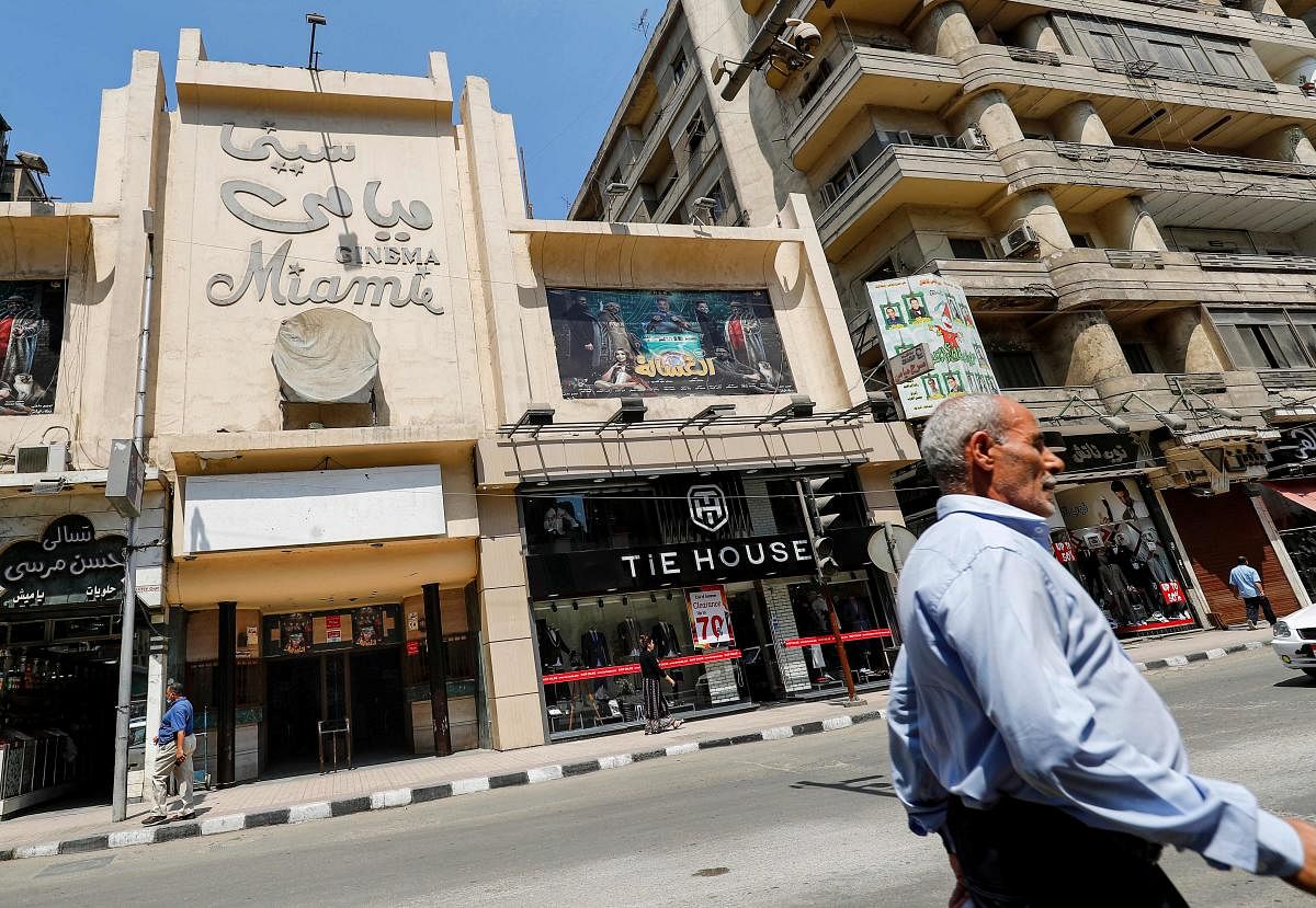 This picture taken on August 26, 2020 shows a view of the landmark Miami cinema theatre along the commercial Talaat Harb street in the city centre of Egypt's capital Cairo. - Egyptian cinemas are slowly reopening after months of lockdown, but the huge sector sometimes dubbed the Hollywood of the Arab world has taken a severe hit during the pandemic. AFP