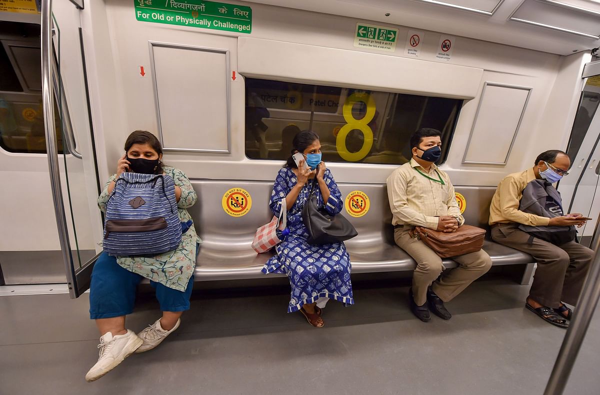 Commuters travel in a metro train in Delhi with some distance due to the Covid-19 pandemic. Credit: PTI