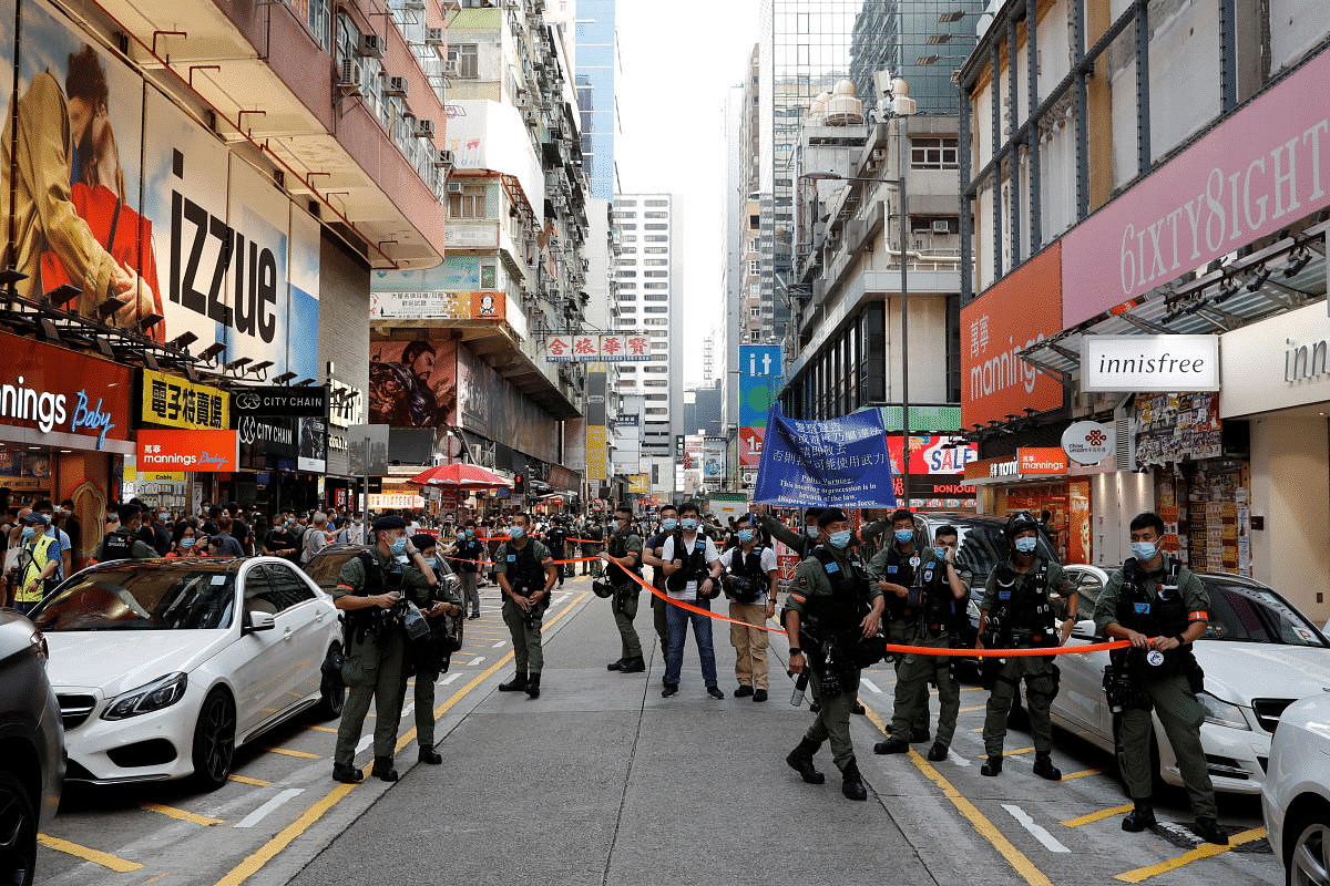 Riot police stand guard to prevent people from gathering during a demonstration opposing postponed elections, in Hong Kong, China. Credit: Reuters Photo