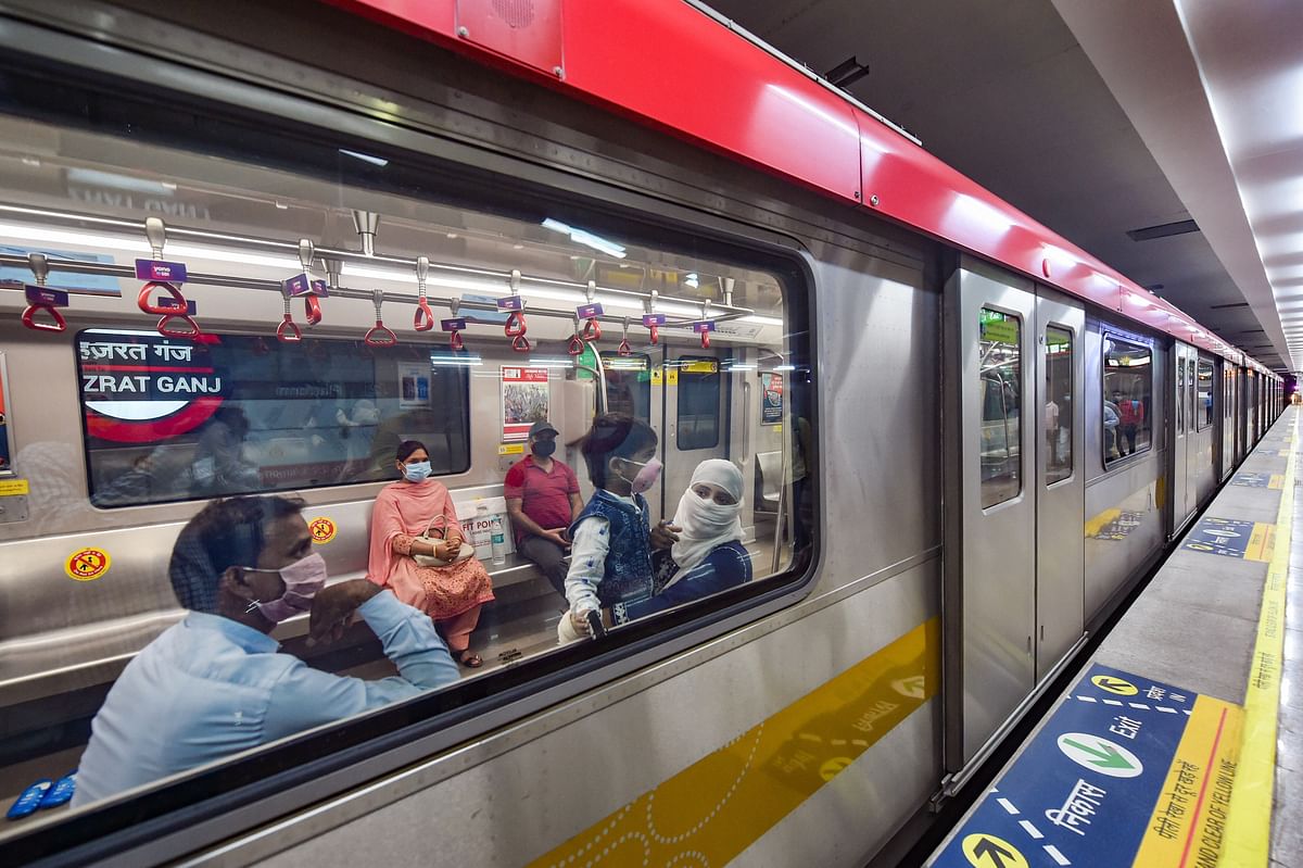 Passengers maintaining physical distance travel in a metro train as Lucknow Metro resumes services after over five months suspension due to Covid-19 outbreak, in Lucknow. Credits: PTI