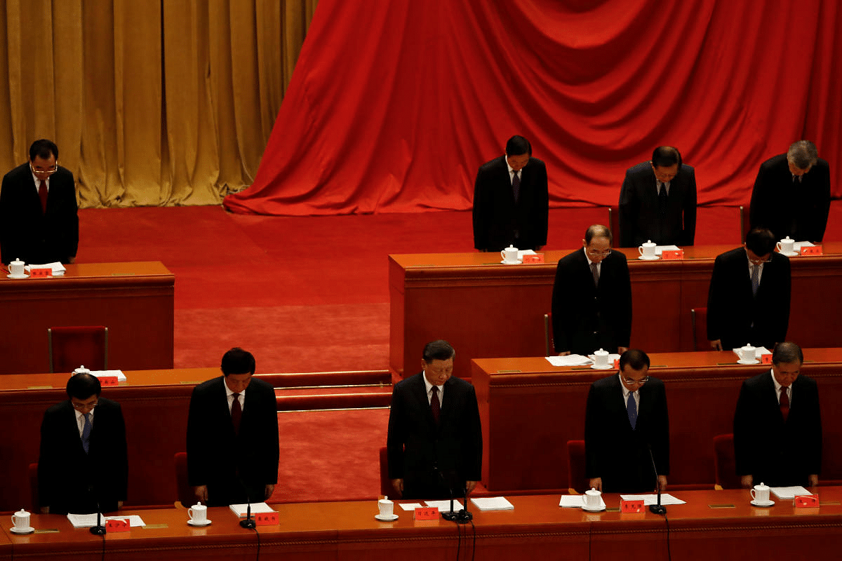 Chinese President Xi Jinping observes a minute of silence during a meeting to commend role models in China's fight against the coronavirus disease (COVID-19) outbreak, at the Great Hall of the People in Beijing, China. Credit: Reuters Photo