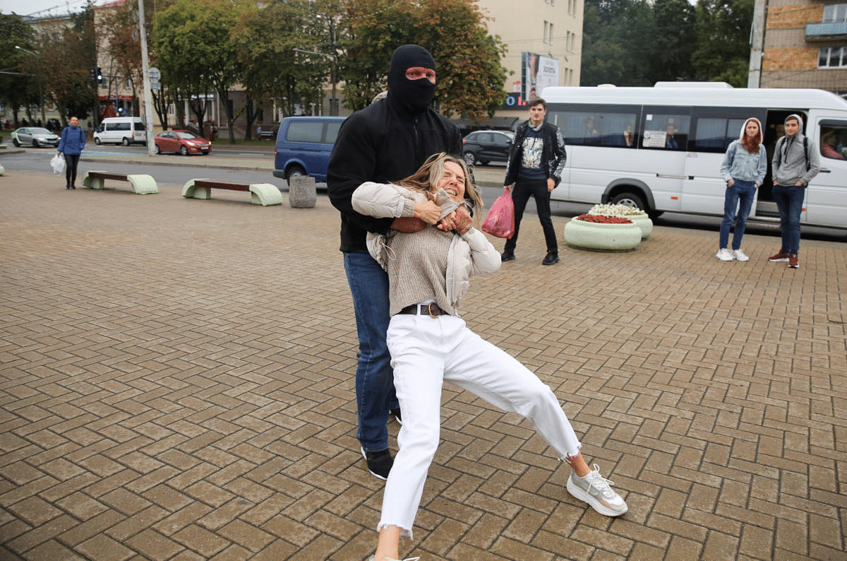 A law enforcement officer drags a demonstrator during a rally in support of detained Belarusian opposition leader Maria Kolesnikova in Minsk, Belarus. Credit: Reuters Photo