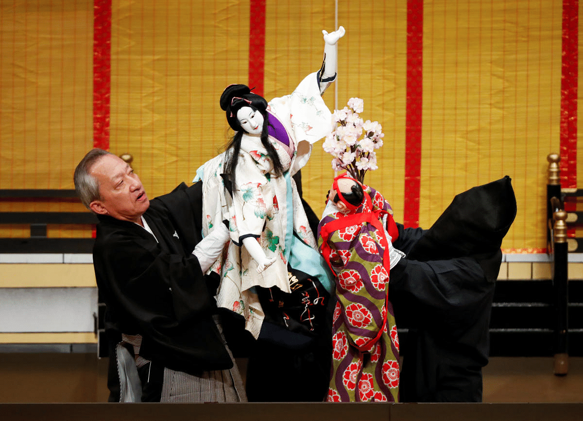 Kanjuro Kiritake, a Bunraku puppeteer who was designated a Living National Treasure by the Japanese government, performs Japan's traditional puppet drama called 'Bunraku', which emerged in 15th century and the characters are manipulated by three puppeteers, during a program titled Komochi Yamanba (The Pregnant Mountain Ogress) at the National Theatre in Tokyo, Japan. Credit: Reuters Photo