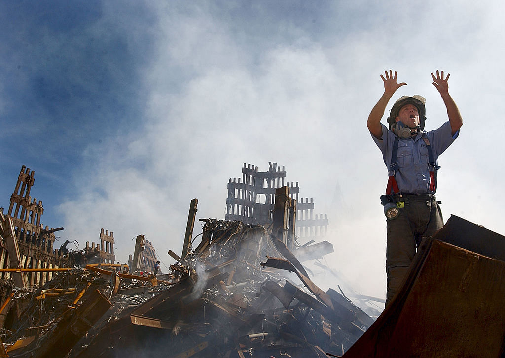 A New York City fireman calls for 10 more rescue workers to make their way into the rubble of the World Trade Center September 14, 2001 days after the September 11, 2001 terrorist attack. Credit: Getty Images