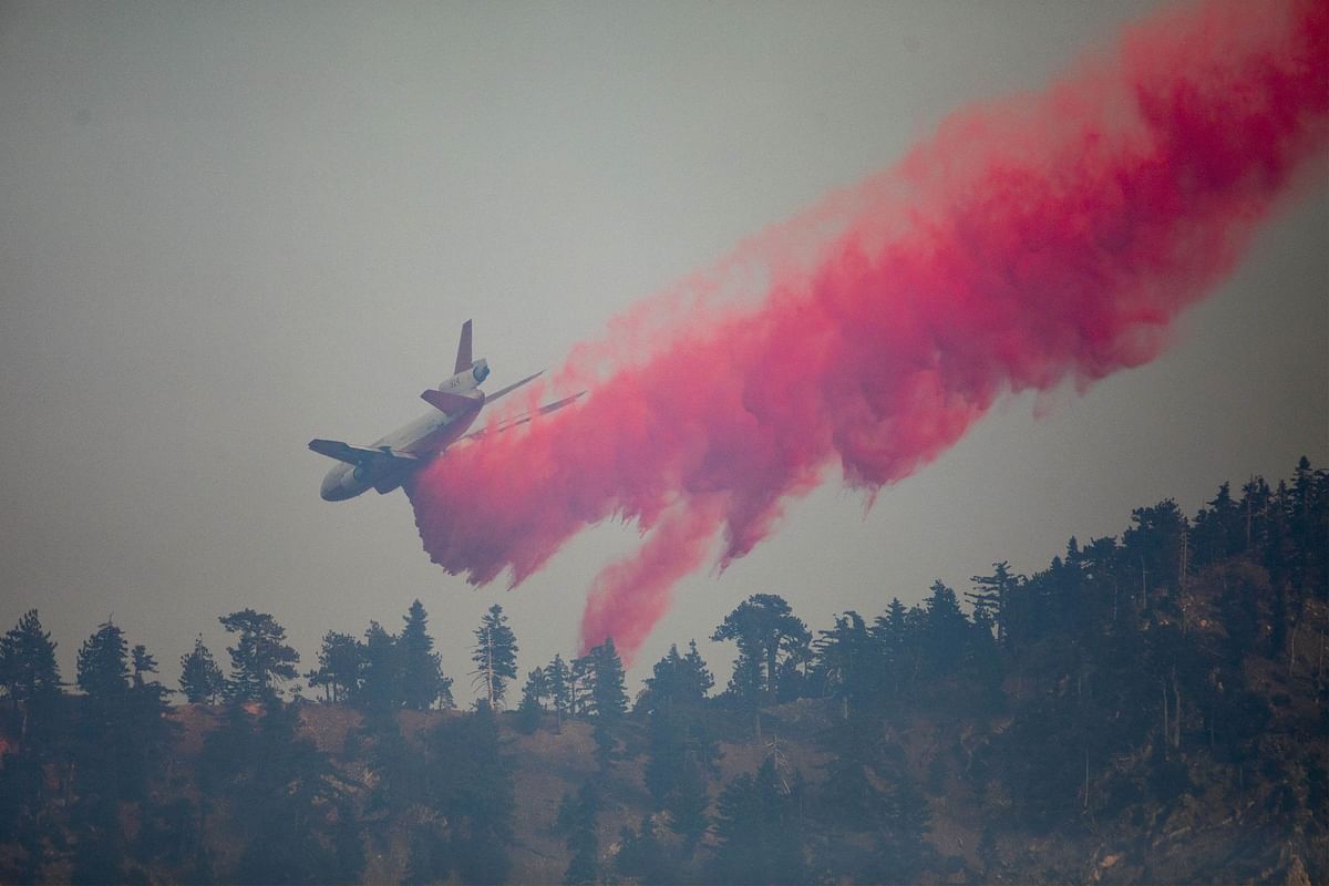 A firefighting jet tanker drops fire retardant on the Bobcat Fire at the Angeles National Forest on September 11. Credit: AFP Photo