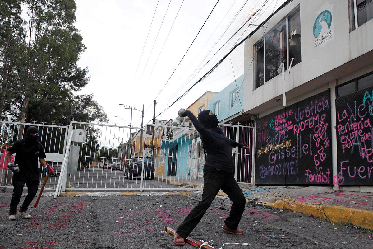 Members of a feminist collective vandalize the facilities of the state of Mexico's human rights commission, in support of victims of gender violence, in Ecatepec, State of Mexico, Mexico. Credit: Reuters Photo