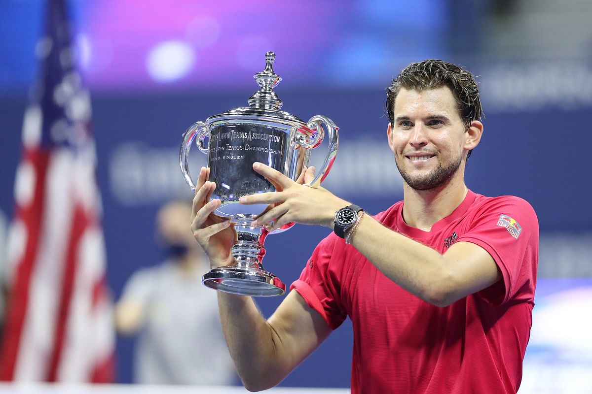 Dominic Thiem of Austria celebrates with championship trophy after winning in a tie-breaker during his Men's Singles final match against Alexander Zverev of Germany on Day Fourteen of the 2020 US Open. Credit: AFP