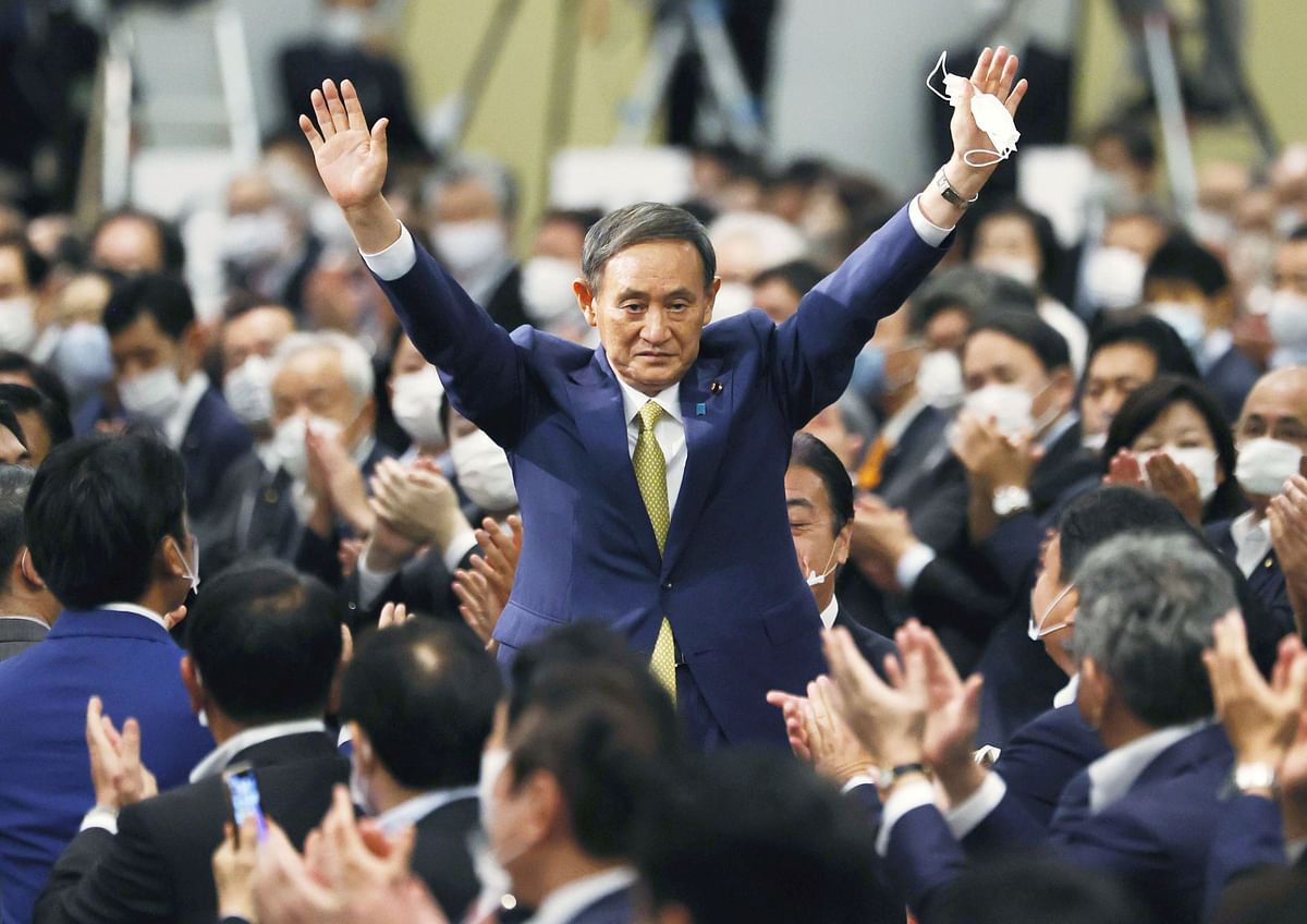Japanese Chief Cabinet Secretary Yoshihide Suga gestures as he is elected as new head of the ruling party at the Liberal Democratic Party's (LDP) leadership election paving the way for him to replace Prime Minister Shinzo Abe, in Tokyo, Japan. Credit: Reuters
