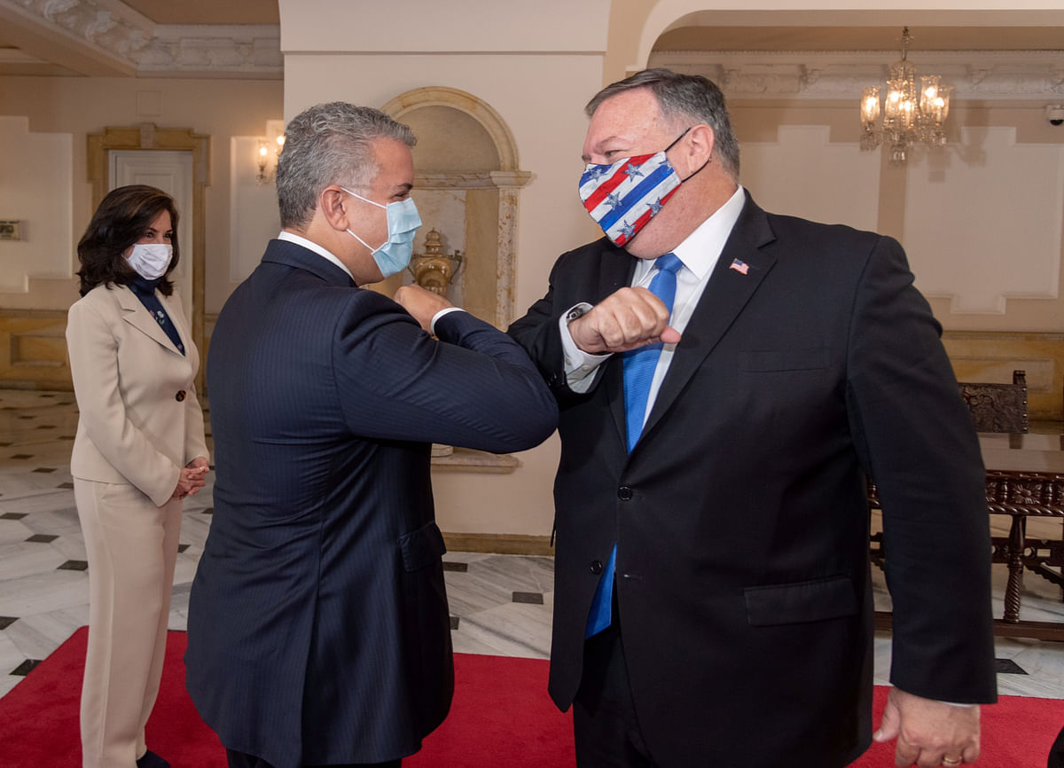 Colombian President Ivan Duque Marquez and US Secretary of State Mike Pompeo bump elbows before attending a meeting at the presidential house in Bogota, Colombia. Credit: Reuters
