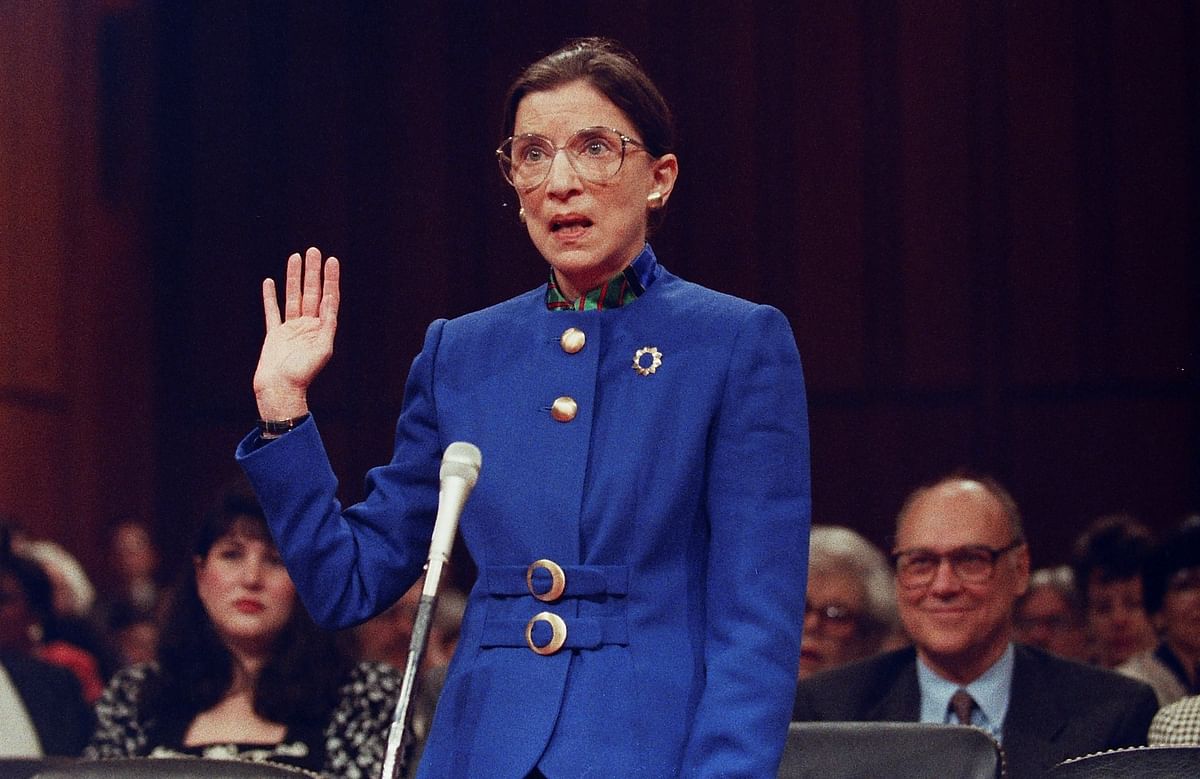 US Supreme Court nominee Judge Ruth Bader Ginsburg speaks as she is sworn-in during her confirmation hearing before the Senate Judiciary Committee, as her husband Martin looks on, on Capitol Hill in Washington, July 20, 1993. Credit: Reuters