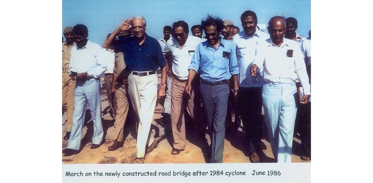 Dhawan marching on the newly-constructed road bridge after cyclone in June 1986.
