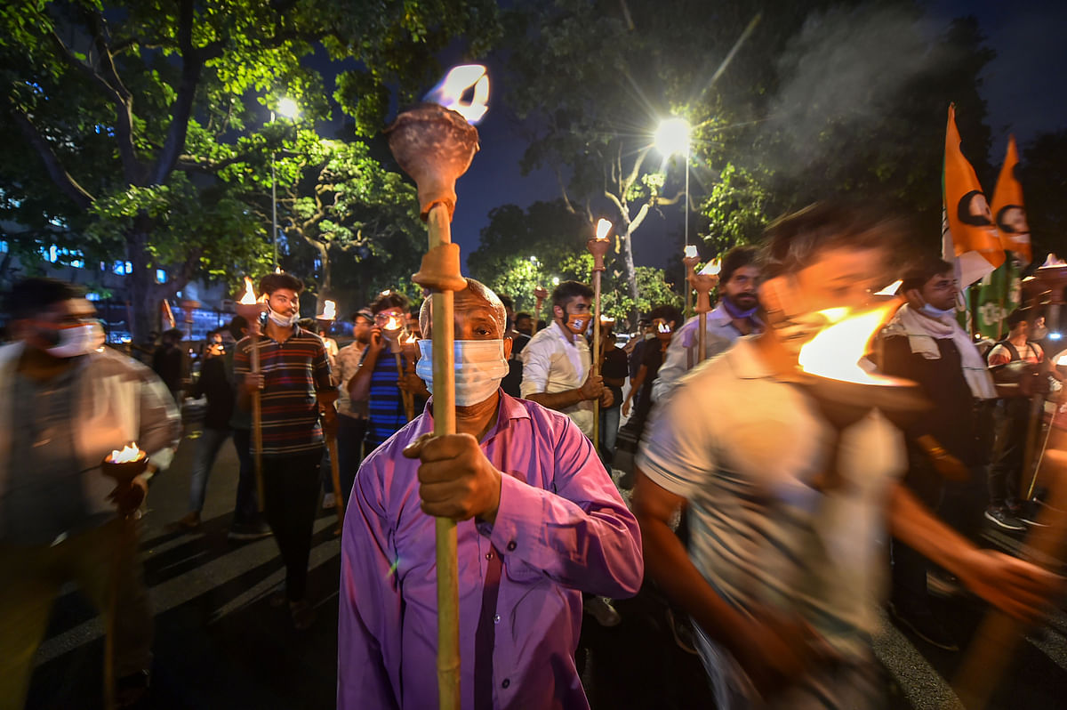 Indian Youth Congress (IYC) activists participate in a torch procession in New Delhi. Credit: PTI